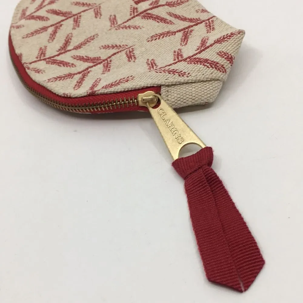 FEED 10 Clarins makeup cosmetics light tan and red carry-all pouch